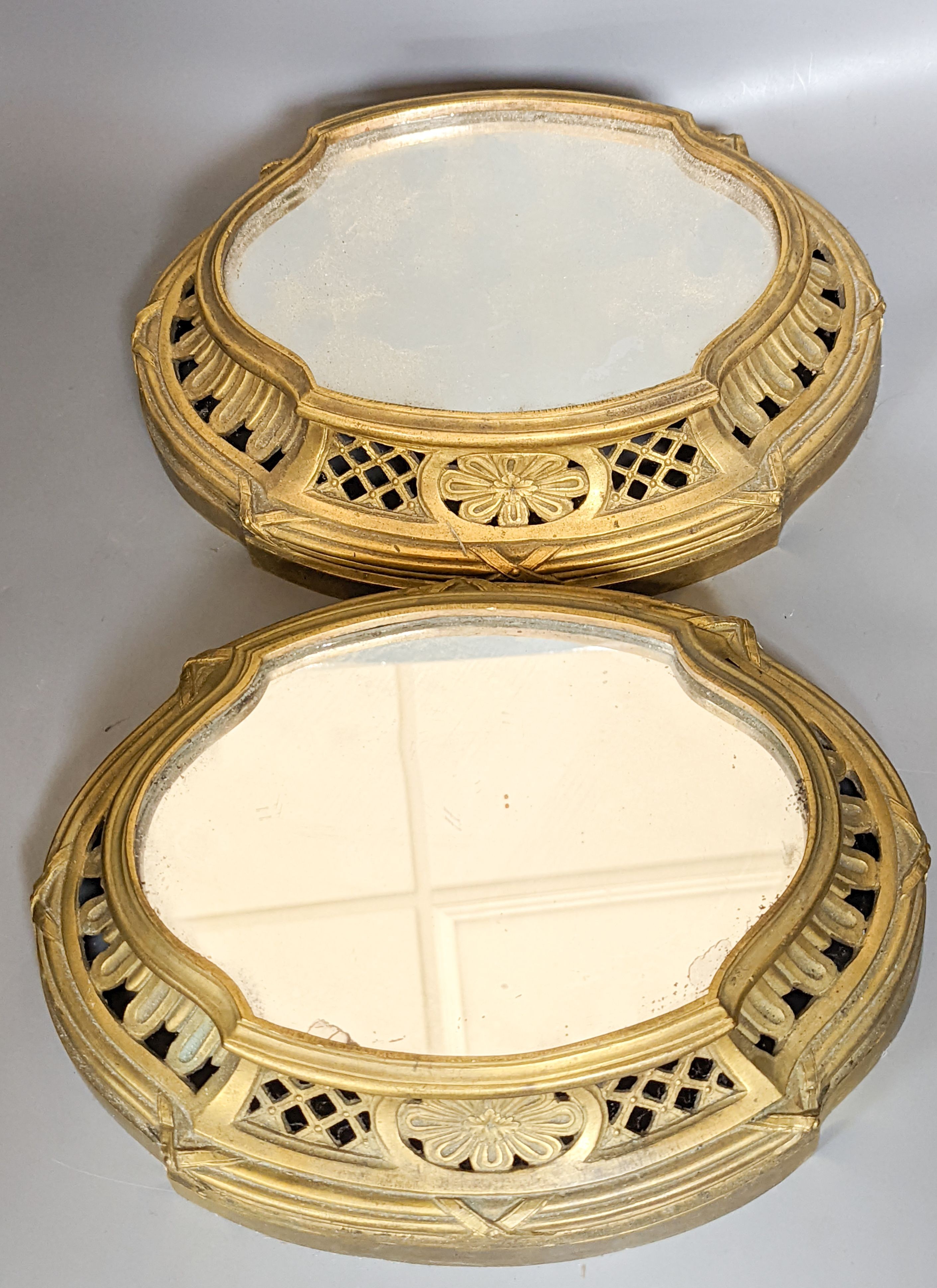 A pair of mirrored ormolu plateaus, 28cm